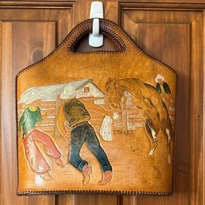 Vintage hand tooled and constructed leather rodeo purse